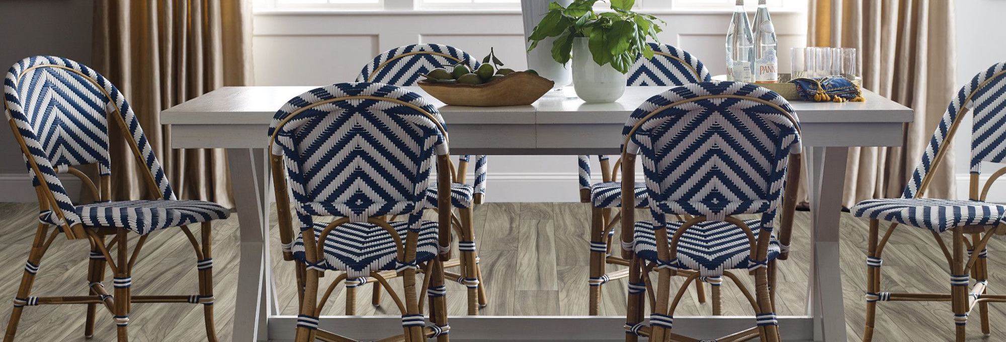 Dining room with woven blue chairs